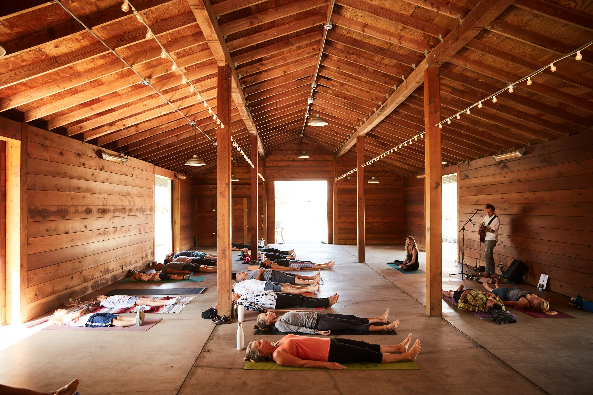 Inspirational Addict wellness influencer Andrea Bogart leads yoga and live music event with Kevin Paris at Cornerstone Sonoma Garden Barn
