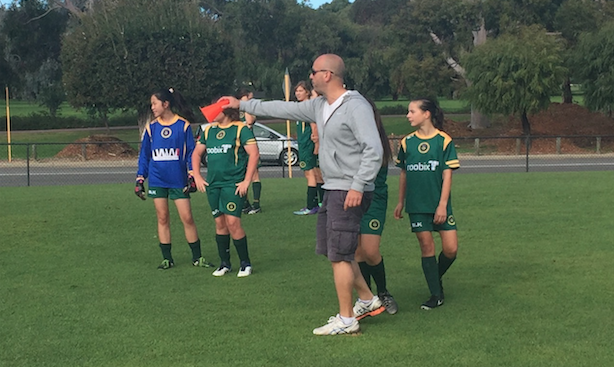 14 girls coach Chris Mallios instructs his team