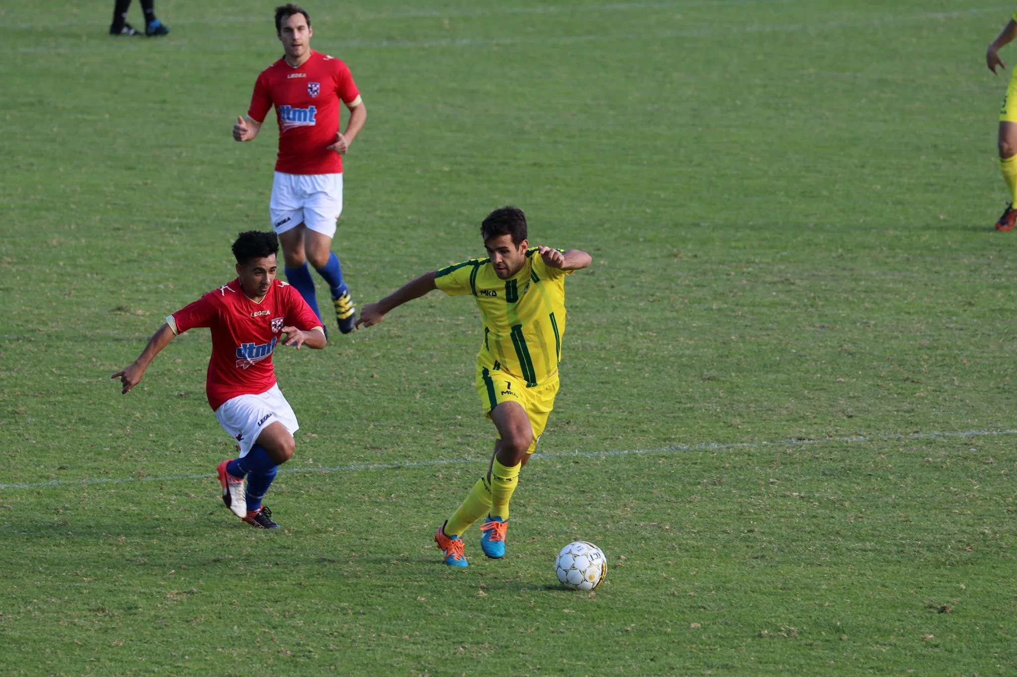 TIM ROBERTSON EVADES A DEFENDER IN THE DERBY EARLIER THIS SEASON - CREDIT: GABRIELE MALUGA