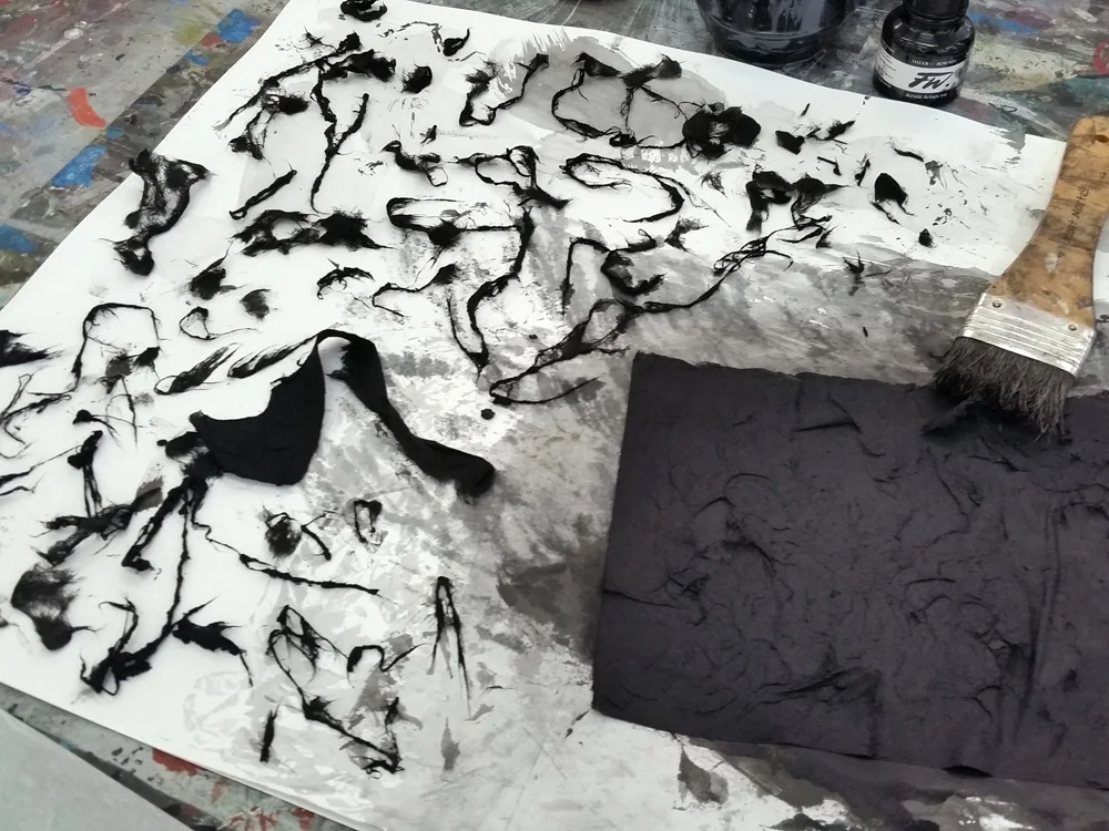 Japanese silk paper covered with acrylic in and gently rubbed to produce fragile fibres
