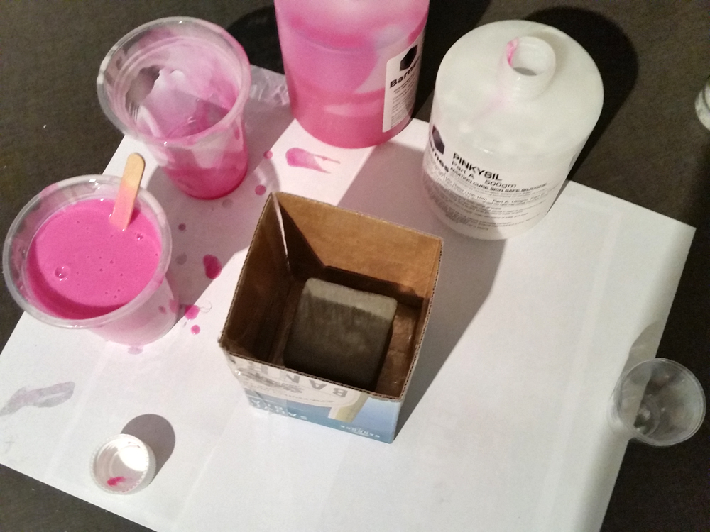 The clay cube is inside the box and Pinkysil is mixed up, ready to pour into the box
