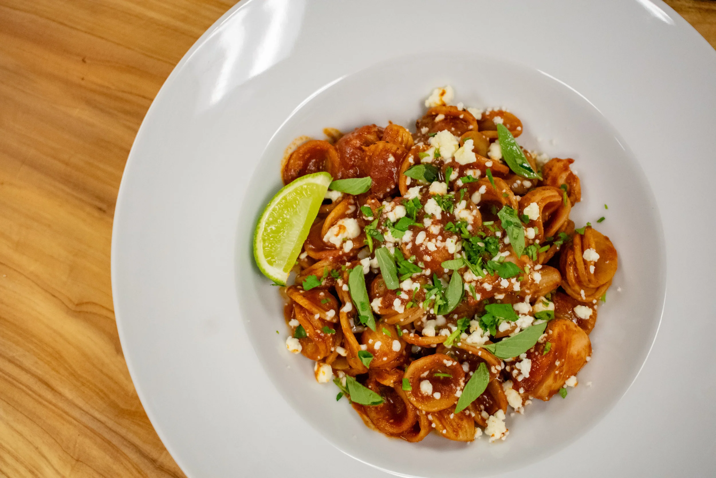 Pulled Chicken Mole Orecchiette with Cojia Cheese & Fresh Lime