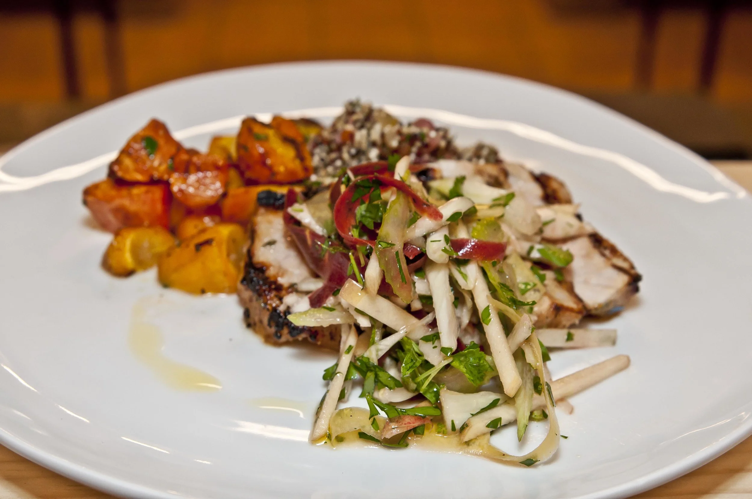 Apple marinated grilled pork loin, Chinese sausage quinoa pilaf, maple roasted carrot & apple-fennel slaw