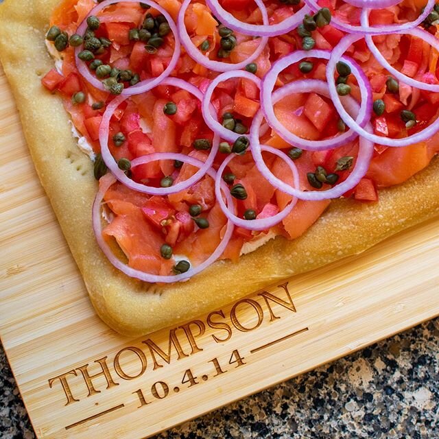 Scenes from Christmas Brunch: Smoked Salmon Flatbread -house-made &lsquo;everything&rsquo; bagel crust, whipped local cream cheese, wild-caught smoked Alaskan salmon, fresh tomatoes, capers, slivered onion and native herbs. Cutting board courtesy of 