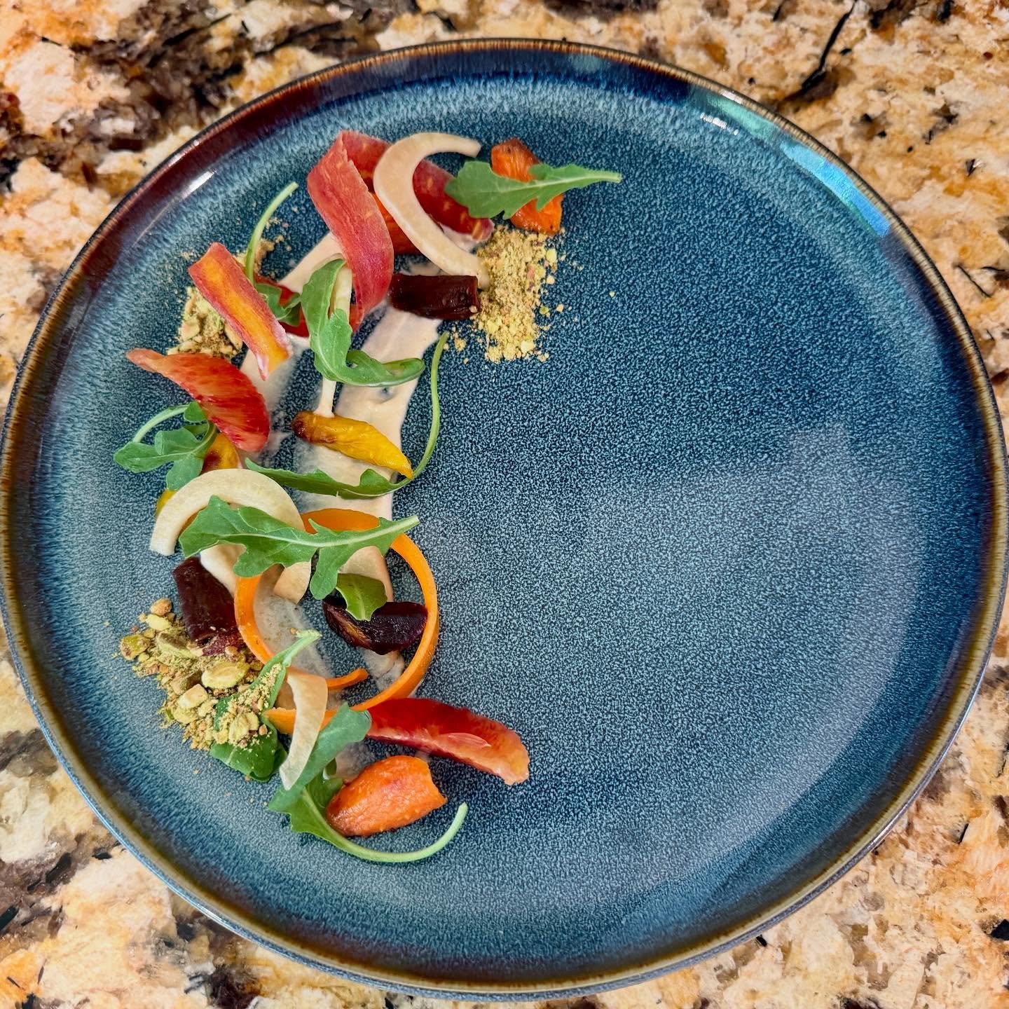 Heirloom Carrot & Citrus Salad | Roasted rainbow carrots, blood orange segments, pickled fennel, arugula, and pistachio dust with a tahini-lemon dressing #sustainability #foodsystems #plantbased #vegan @restaurahospitality #vegansofinstagram #veg