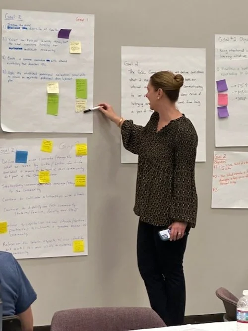 4.24.24 Christy with pen reading.jpg