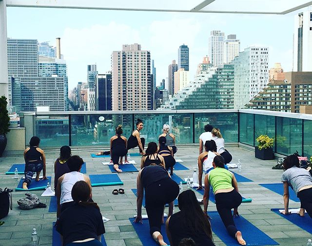 Rooftop yoga season is one of my favorite seasons! #corporateyoga #corporatewellness #residentialyoga #residentialwellness #janicekellywellness