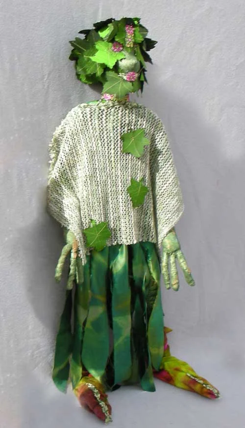 Green Person with Beaded Eyes and Mouth