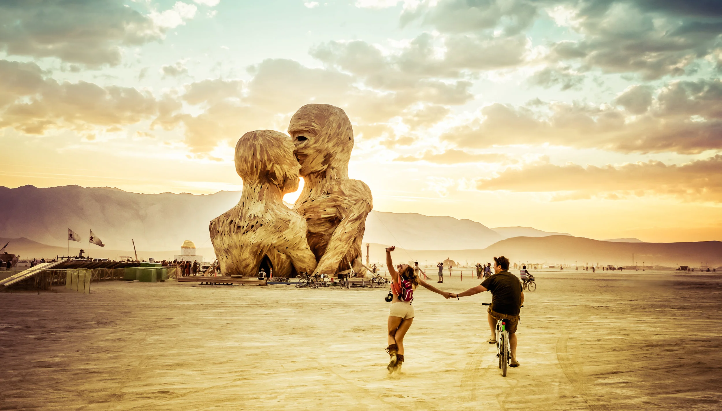 Photo of my wife and I headed towards Embrace at Burning Man 2014 courtesy Trey Ratcliff .