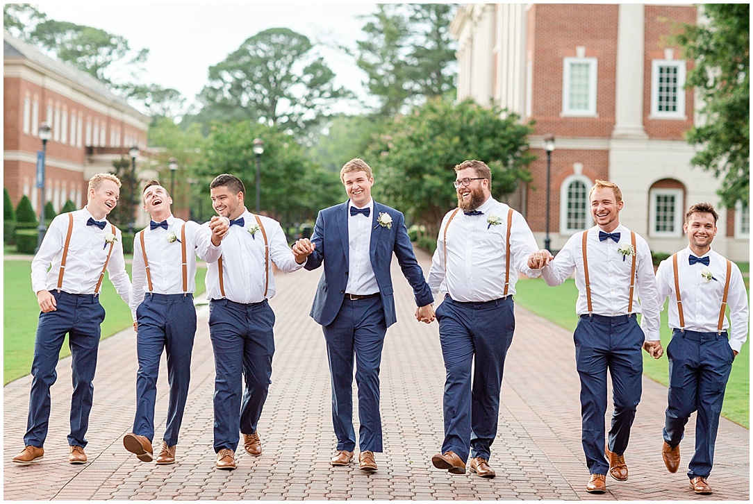  I always cue the guys to walk and while doing so they can pick on the groom, tell jokes, etc…and these guys decided to hold hands hahah! Never a dull moment with the groomsmen! 
