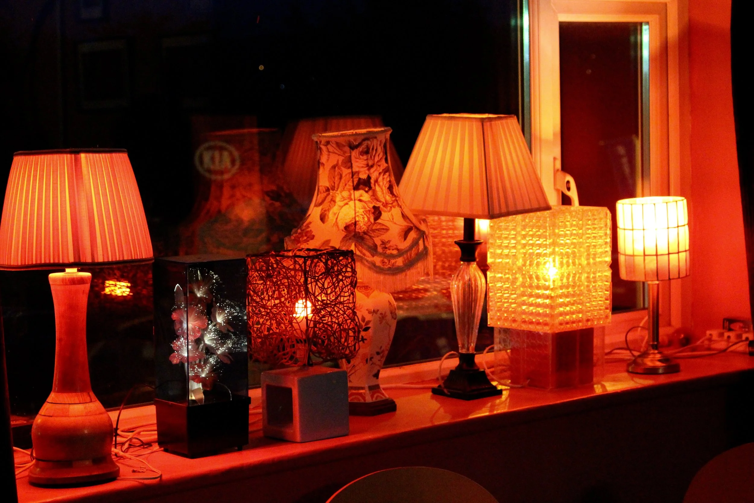 A nice collection of vintage lamps at the windowsill
