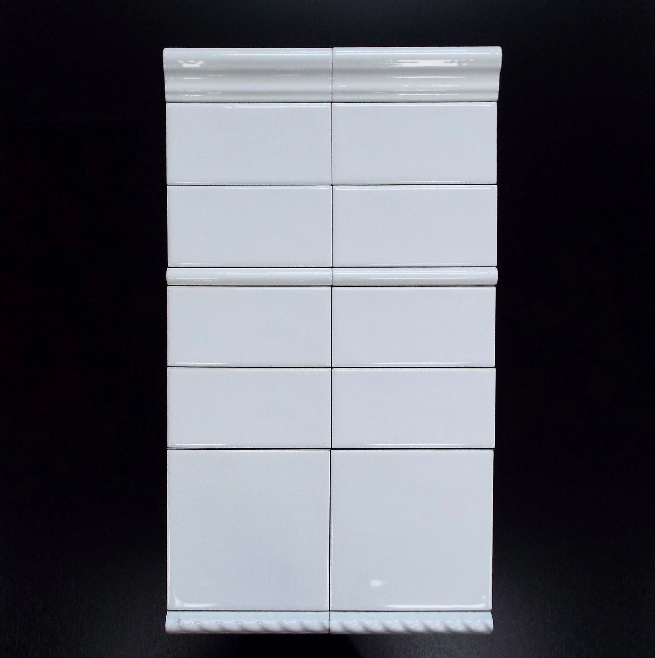 SNOW WHITE 3"X6" UNDULATED GLOSSY WALL-88 PC/CTN (10.76 SF); 64 CTN/PLT 2"X6" CHAIR RAIL - 20 PC/CTN 5/8"X6" PENCIL - 77 PC/CTN 6"X6" UNDULATED GLOSSY WALL - 44 PC/CNT(10.76 SF); 64CTN/PLT 5/8"X6" ROPE - 40 PC/CTN 3"X6" BULLNOSE AVAILABLE - 88 PC/CTN