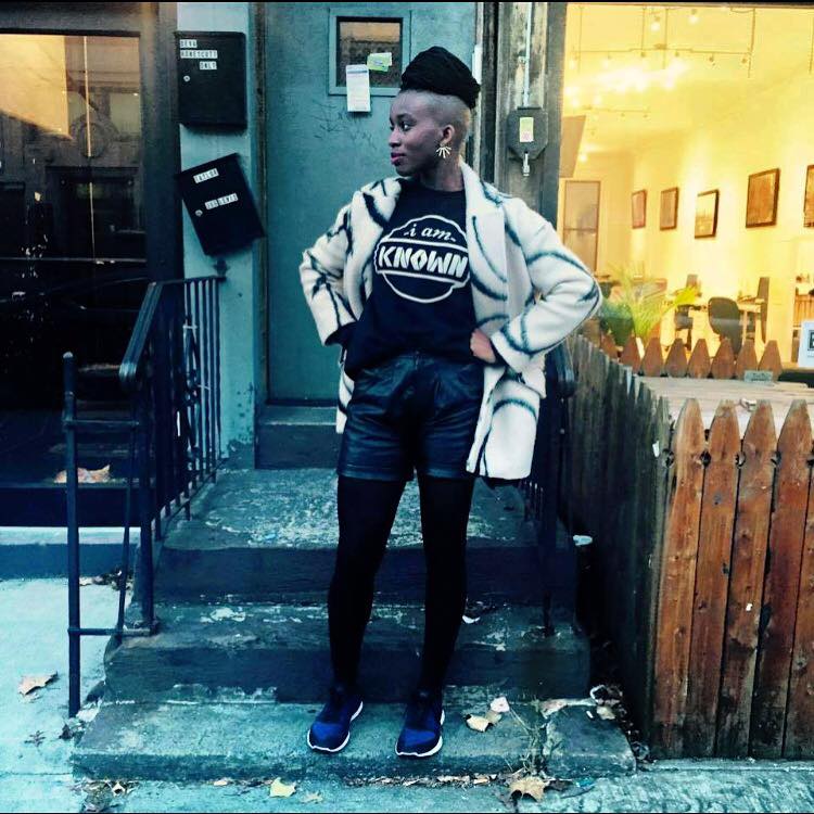 Yvonne from the "I am Known" campaign sporting the sweatshirt they give to homeless people in Brooklyn.