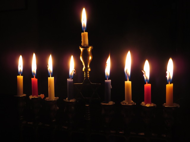 The center candle is the Shamash, the attendant candle. This candle is used to ignite the others, and stands ready to rekindle any that may go out.