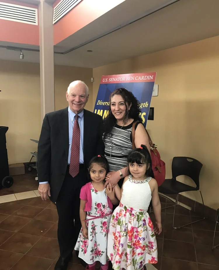 Roxana is pictured here with two of her children and US Sen. Ben Cardin of Maryland.