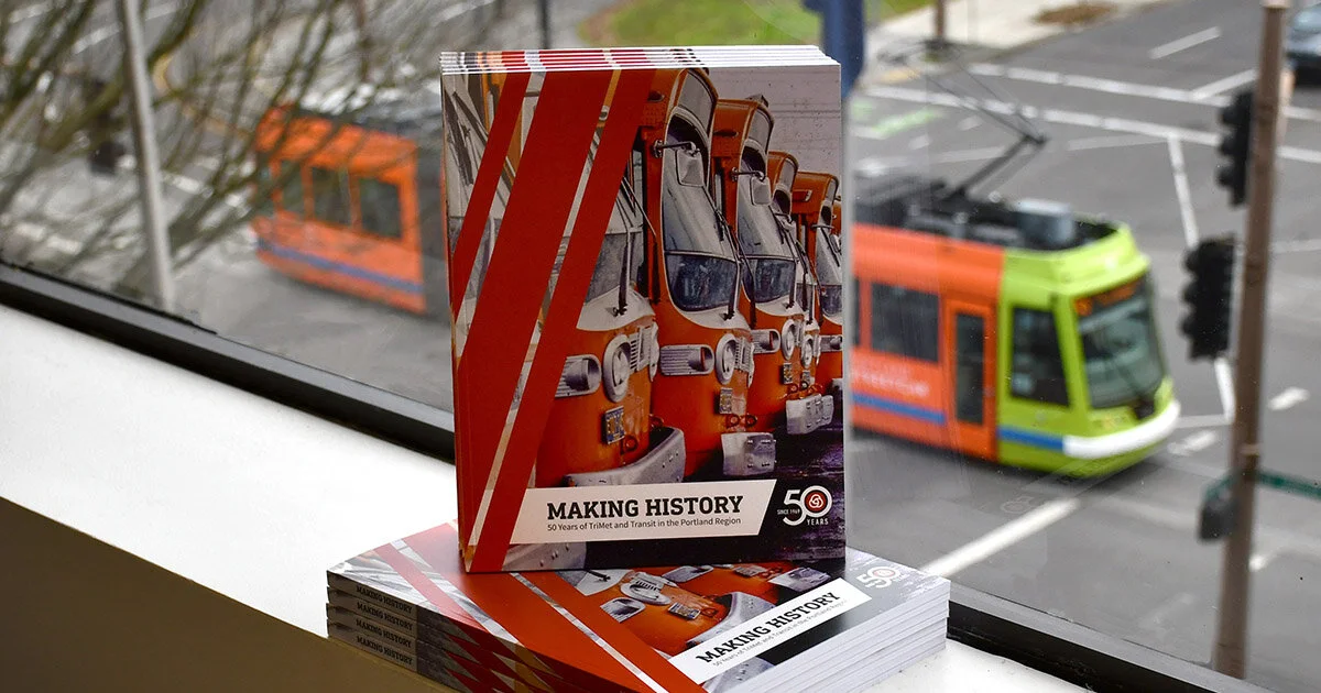  Stack of printed TriMet 50-year history books 