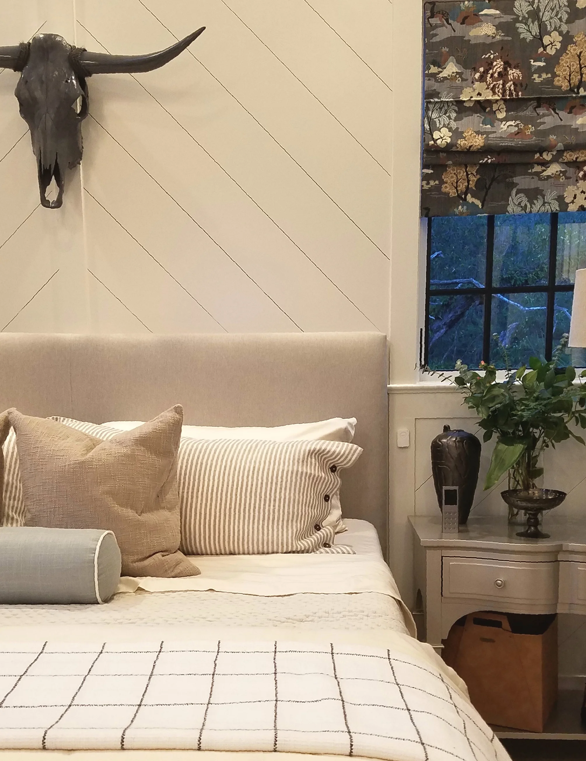 To the right of the headboard, that little white device mounted to the wall is the SimpliSafe panic button. If you’re at home during an intrusion, press the button to instantly trigger your alarm and dispatch police.