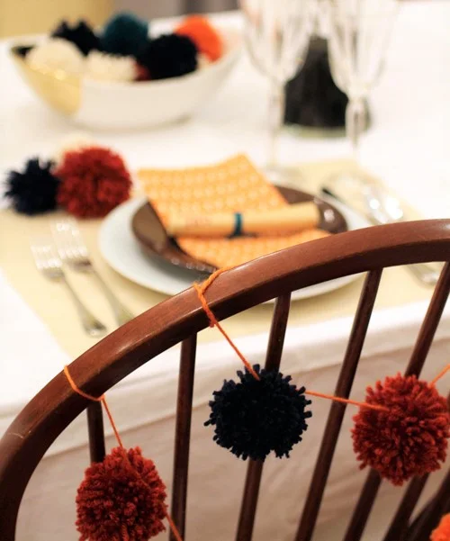 Get the kids making pom poms for your decor (photo by Paige Lewin)