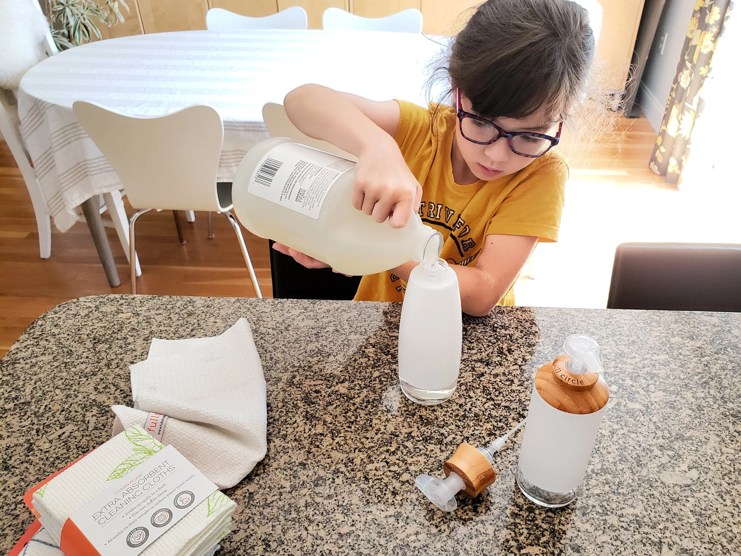 Have kids refill soap bottles on a counter or at the bathroom sink; if they spill soap, they can use it to clean up the surfaces!