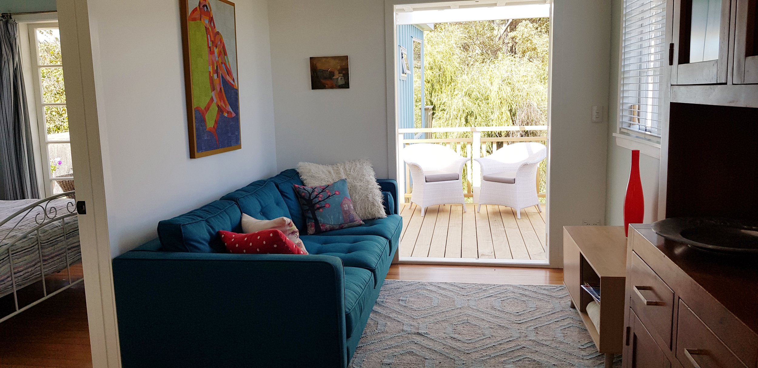 Totara Cottage lounge looking out to deck