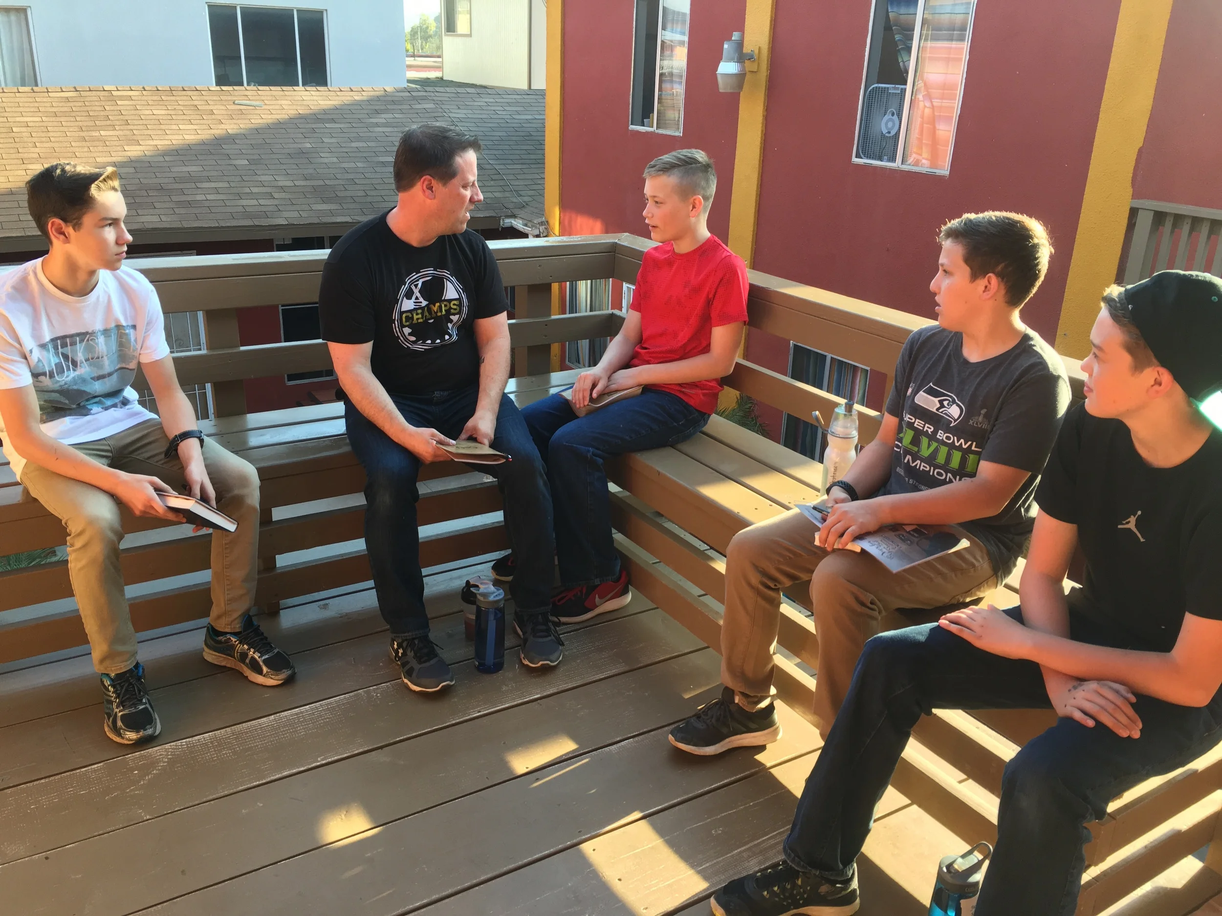 Guys talking about the Bible study
