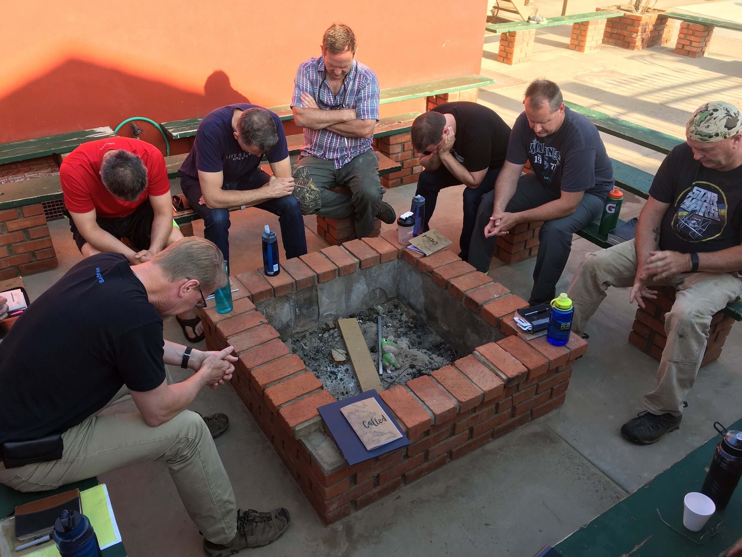 Men praying for the day