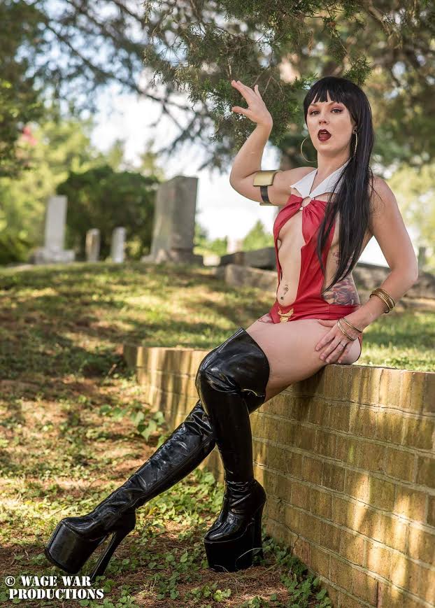 Vampirella 100% done by me. Arm band is foam (she shares with Wondergirl) and the body suit was made by me. I used a bathing suit of mine to make a pattern. Then had to HEAVILY alter the pattern. Added a washer for the center ring and most importantly teeth were custom made by Horror Show Jack Fangsmith Vampy is a personal favorite of mine. She makes me feel dangerous and sexy. The comics are also a favorite. Her character is way more than just a body and I love that about her! Photo by: Jonathan Gibson of Wage War Productions: www.facebook.com/WageWarProductions