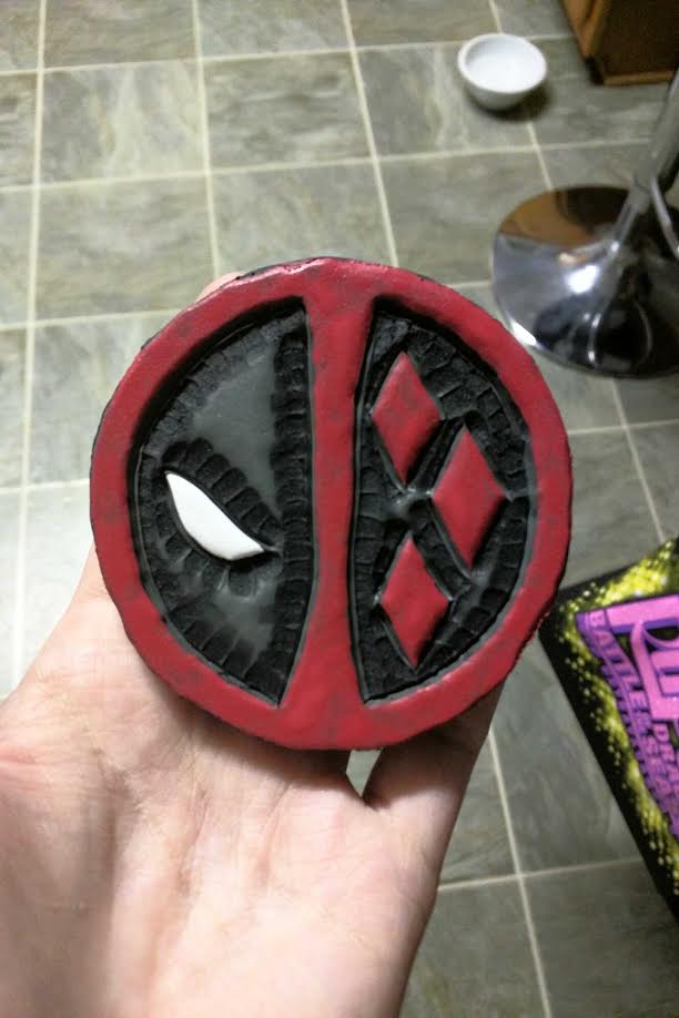 The final touch is acrylic paint. I just needed the red, the white, and a quick spray of acrylic paint sealer. To attach it you can either hot glue or contact cement (what I used) to put some Velcro (what I used)or snap to the back. Seriously this is a simple, quick, and cheap project! This is honestly how I do A LOT of the details on my foam projects!