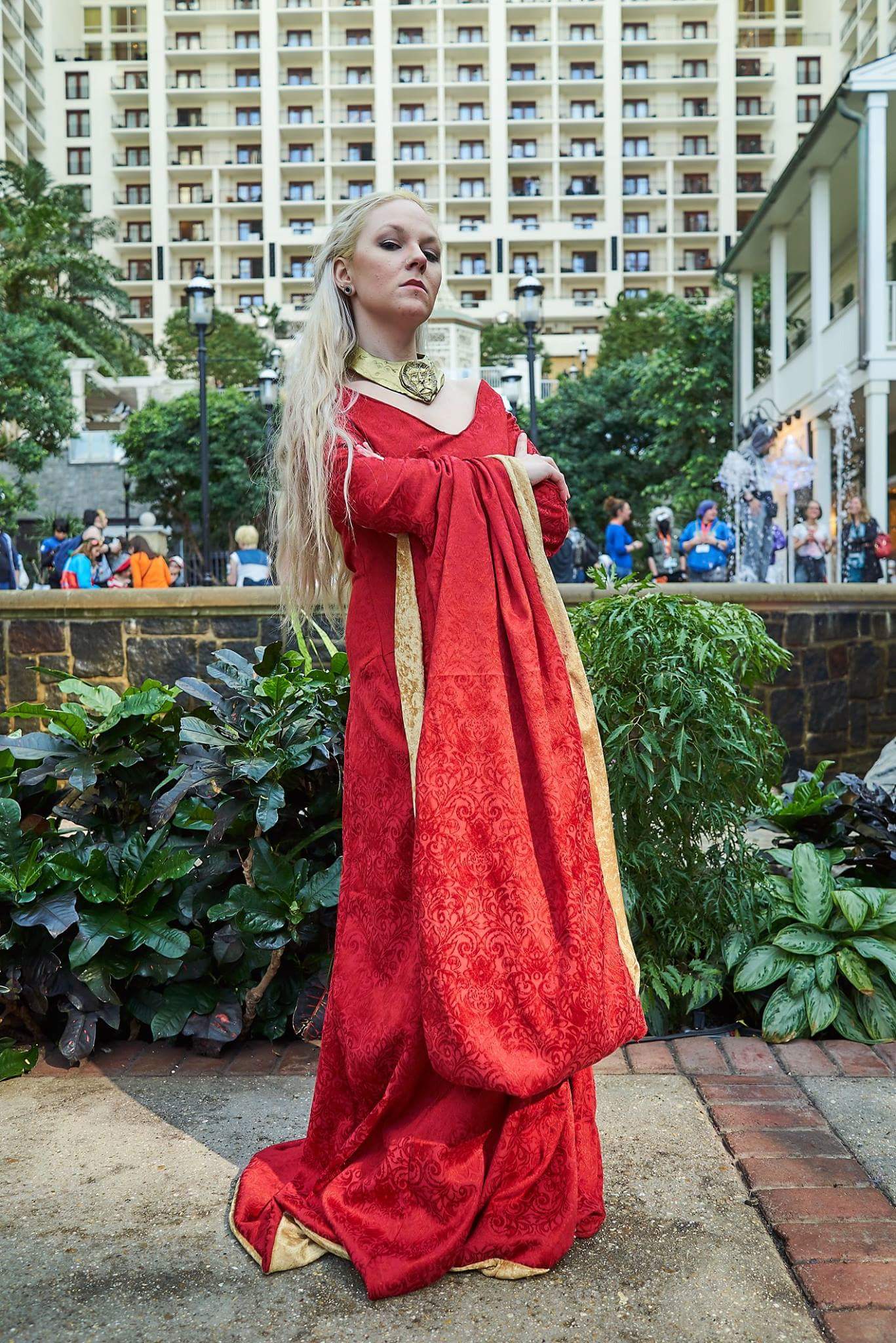 Cersei Lannister- Game Of Thrones I can finally sew well enough! YAY! 100% done by me I've never been so proud of a sewing project before! I used McCalls M6940 pattern for this. The base of the necklace is thin craft foam and worbla. I sculped the lion out of super sculpty and baked it(after the dragon casting fiasco I wasn't risking another failed cast). I glued it onto the worbla with contact cement. Plastidipped (white) and finished with gold spray paint. Then you add a bitchy attitude and a lot of eye rolling. She's so much fun to play. Photo by: www.facebook.com/owlbearmedia