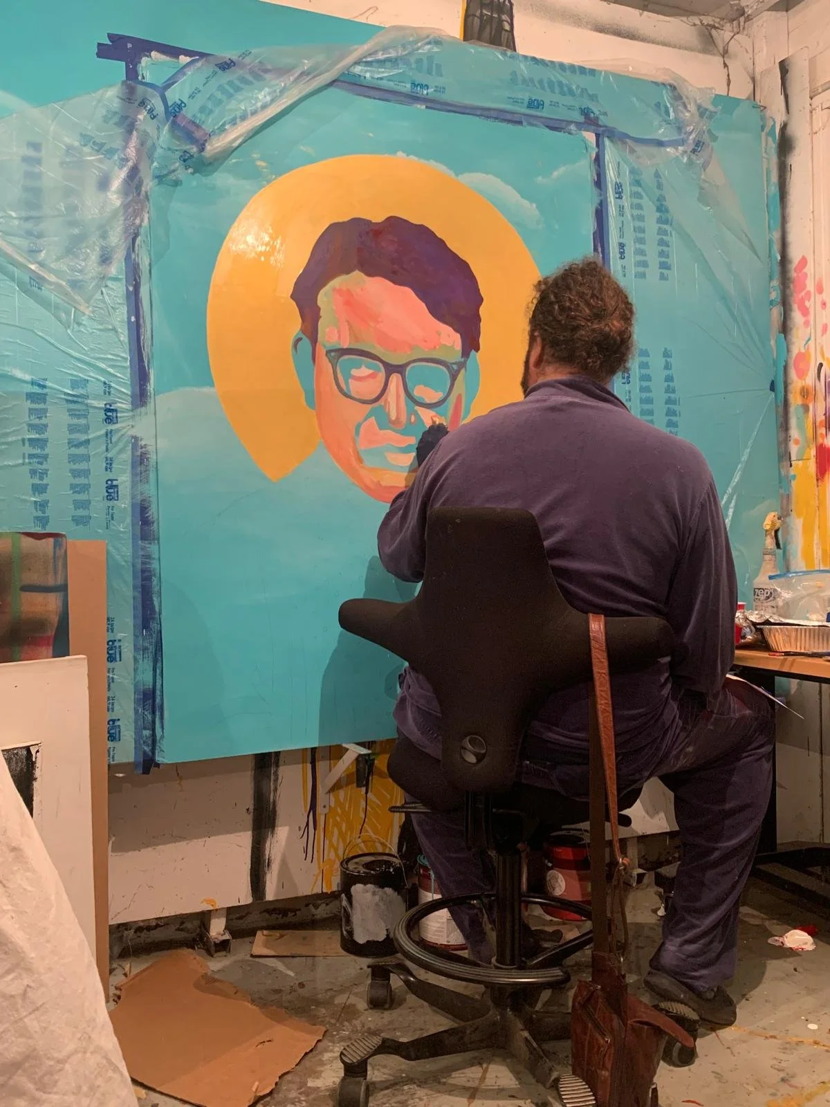 Michael Che Romero painting the face of Dr. Indu Bhusan Mishra