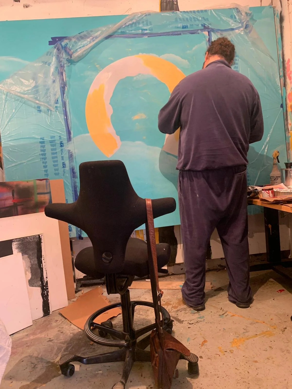 Michael Che Romero painting the gold halo of the portrait of Dr. Indu Bhusan Mishra