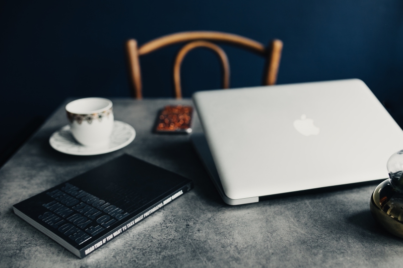 laptop on desk with coffee