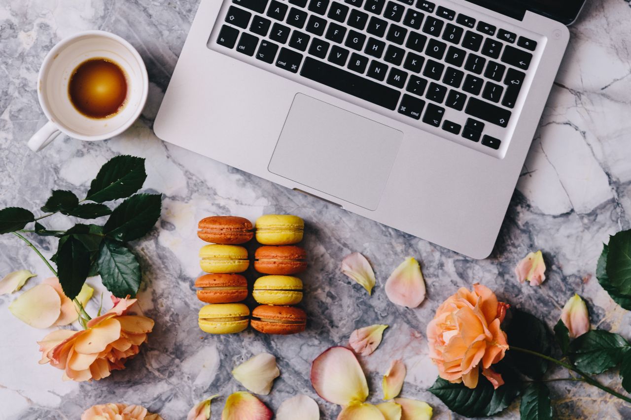 Copyediting laptop with biscuits