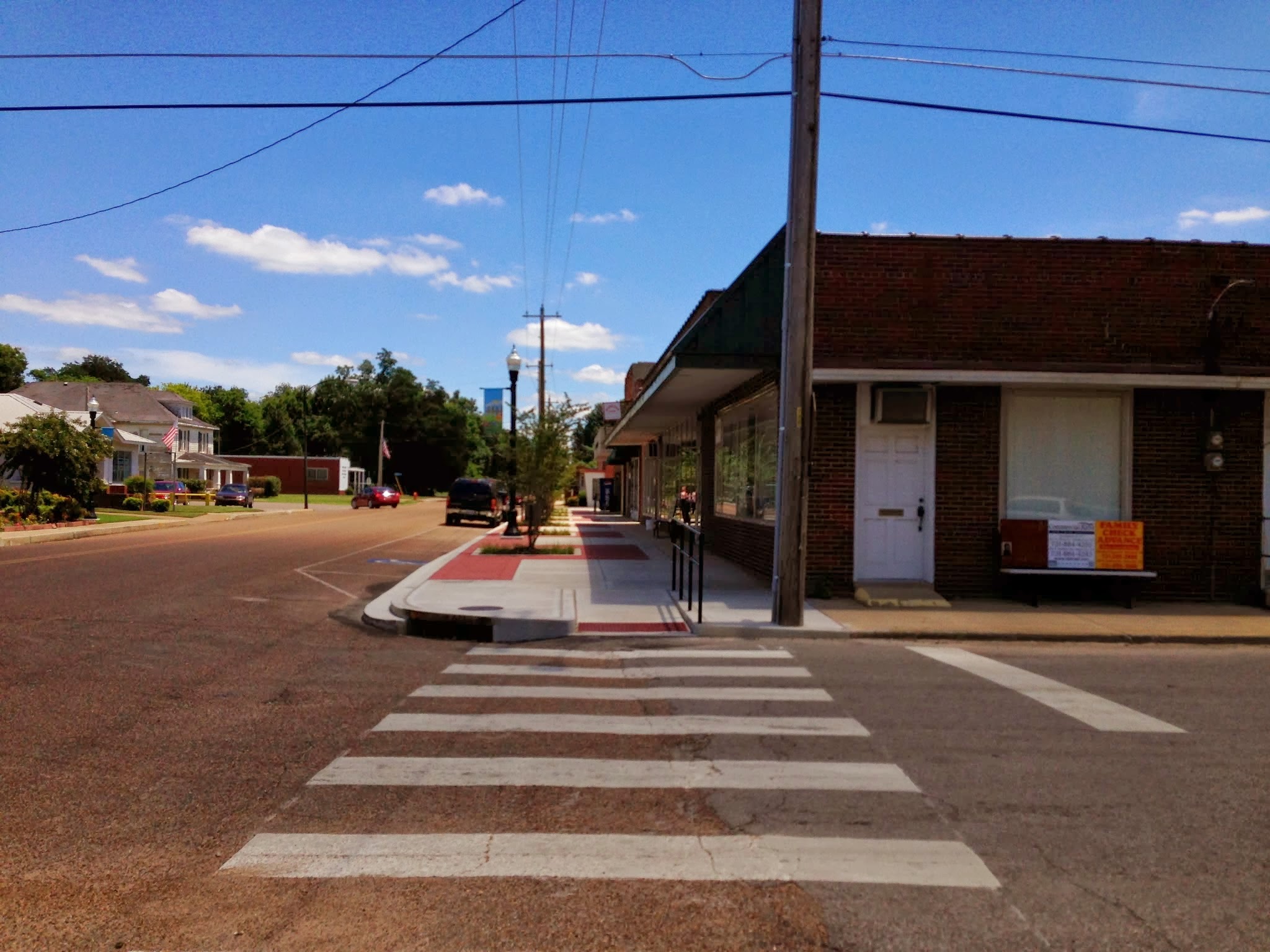 Tiptonvill e, TN streetscap e rehabilita tion. Completed in May, 2013. Provided ADA crossing design and administra tion/permi tting through TDOT. Design Limitations: Per TDOT's requirements, we were unable to alter or disturb the existin