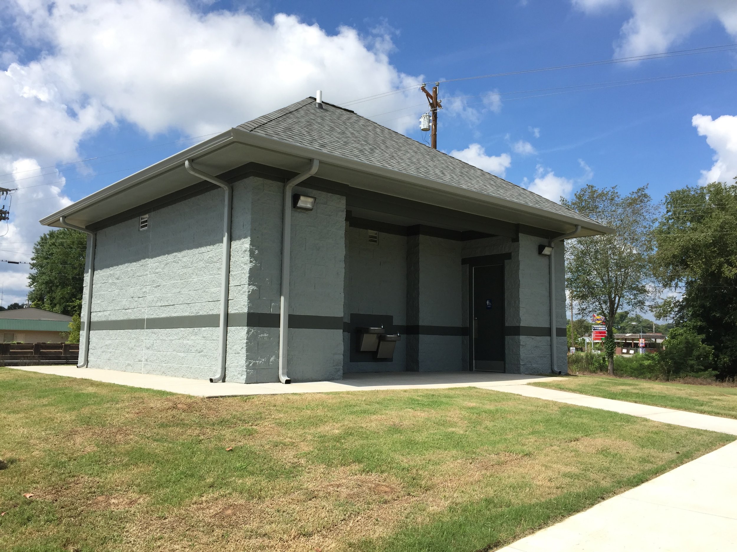 Selmer, TN's Dixie Park Renovations, including a new splash pad, ADA-compliant bathroom, and parking lot. Completed in May, 2016. Provided full civil site design and permitting. Design Limitations: Site located entirely within the floodway of