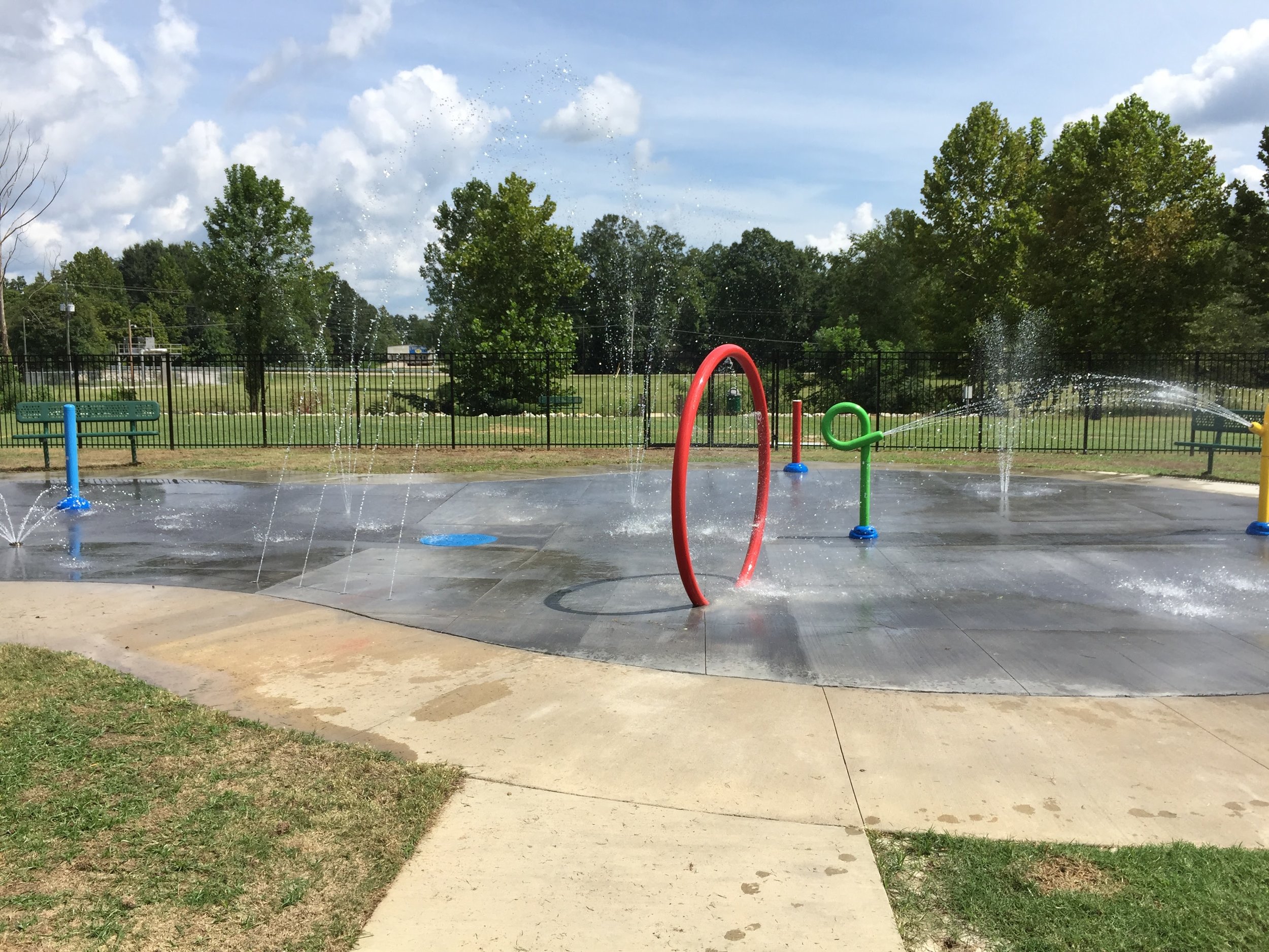 Selmer, TN's Dixie Park Renovations, including a new splash pad, ADA-compliant bathroom, and parking lot. Completed in May, 2016. Provided full civil site design and permitting. Design Limitations: Site located entirely within the floodway of