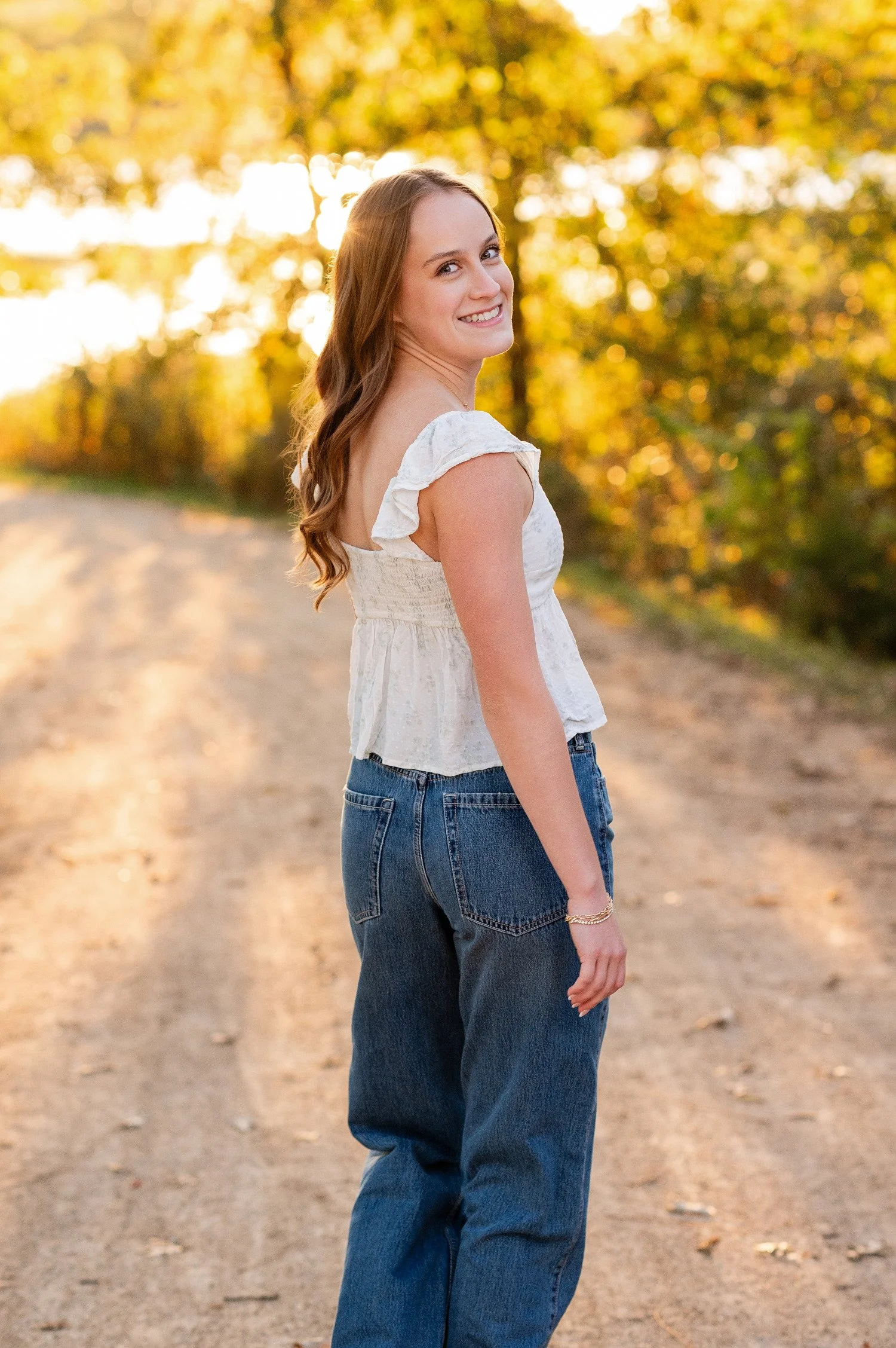 High school senior posing on bridge at Independence Grove Park in Libertyville, Illinois