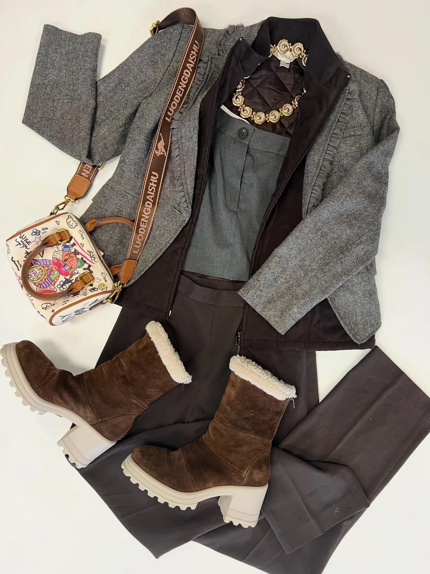 There&rsquo;s wintry business afoot and we&rsquo;re heading that way - where are you going in this outfit? Comment below.

Banana republic wool blend blazer, size M $15 
Zara asymmetrical grey top, size S $15 
Casual corner annex chocolate bead, size