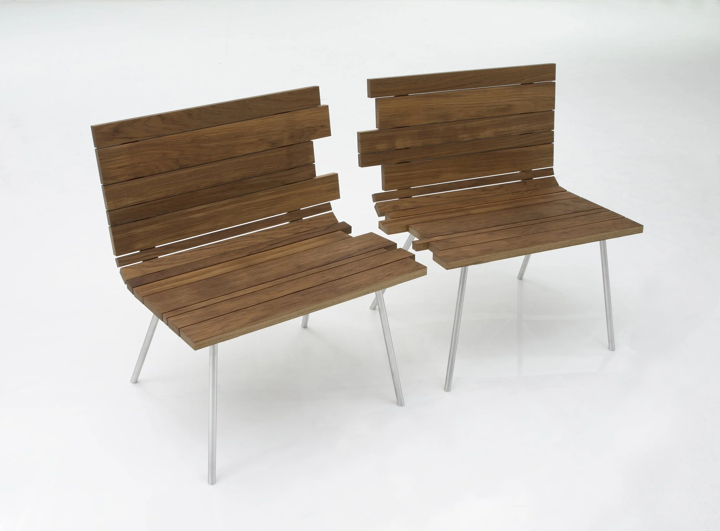 Splinter consists of two interlocking chairs that part along a line of jagged and seemingly broken wood slats. The concept evokes the common fragility of relationships, fortunately in this case the chairs get back together merging elegantly to form a single bench. The teak planks are fastened to the structure with hidden fasteners to give it an elegant look. The teak set functions well both indoors and out.