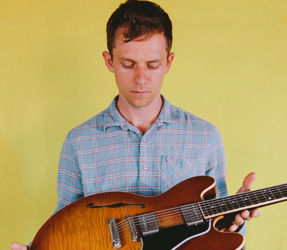 Steve with guitar yellow. jpg.jpeg