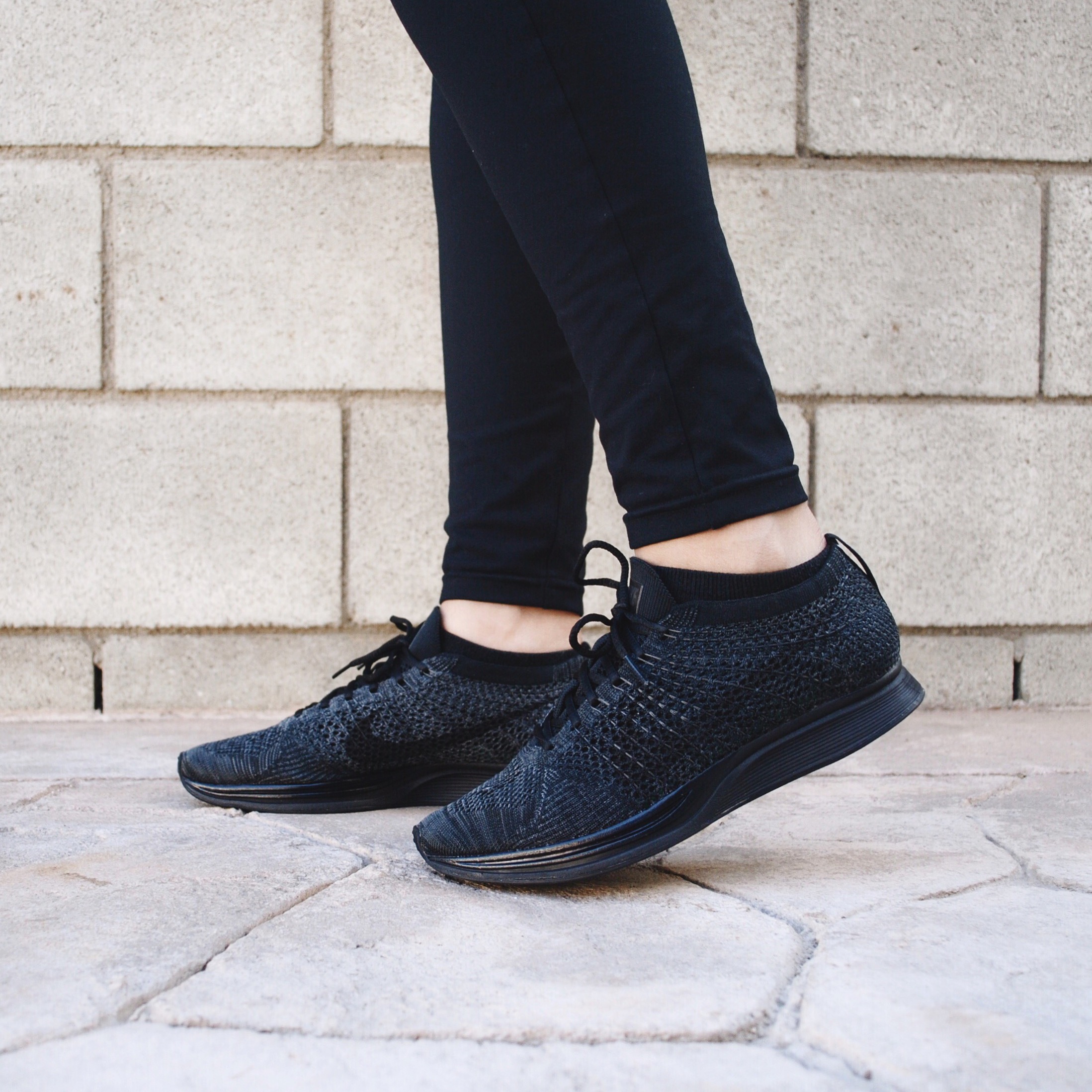 nike flyknit racers triple black