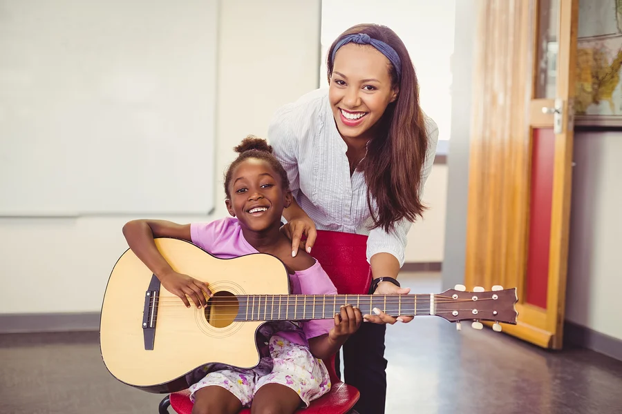 Teacher-assisting-a-girl.jpg