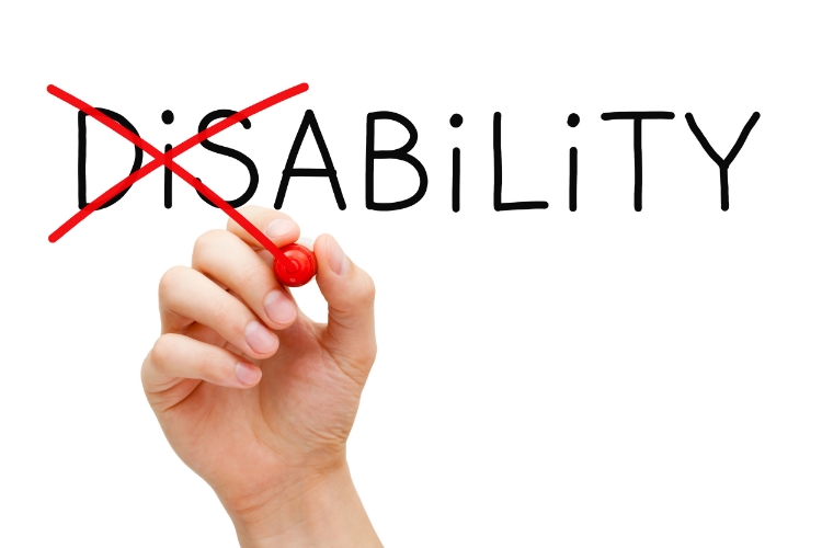 http://images.huffingtonpost.com/2015-09-23-1443029669-9258368-Dollarphotoclub_75515307.jpg Photo Description: A hand holding a red marked finishes crossing the "DiS" off of the word "DiSABiLiTY".
