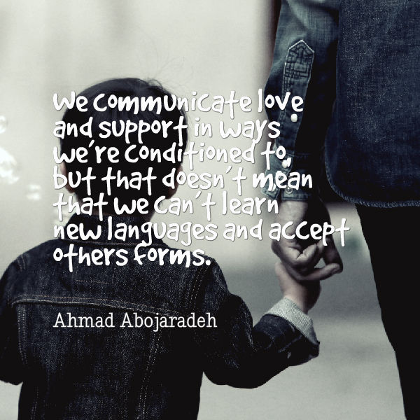 Photo Description: a picture of a child holding a woman's hand, both wearing jean jackets. On the top left there's a quote "We communicate love and support in ways we are conditioned to but that doesn't mean that we can't learn new languages and accept other forms" by Ahmad Abojaradeh. 