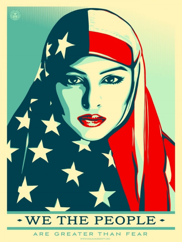 Photo Descriptipon: A poster for the Women's March by Shepard Fairey of a Muslim woman wearing an american flag as a scarf. On the bottom it says "WE THE PEOPLE ARE GREATER THAN FEAR."