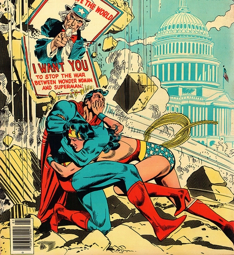 Image Description; On the lower half of the color drawing we see Wonder Woman smashing Superman into a wall, the wall crumbling from the blow. and dust clouds rise to meet the sky. A poster of Uncle Sam on the crumbling wall states "Save the World, I want you to stop the war between Wonder Woman and Superman!." The While House looms, faded, blue against a blue sky, in the background. 