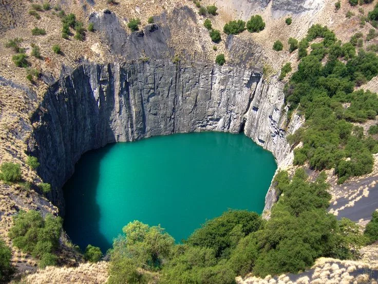 The original mine in South Africa where large deposits of diamonds were found and are still mined, Kimberly Mine.