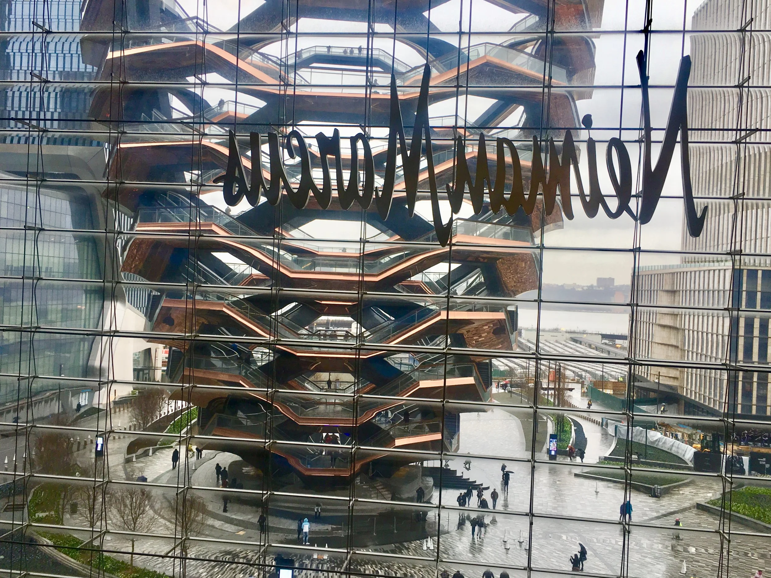 A view of The Vessel and the trains lined up in at Hudson Yards from the interior.