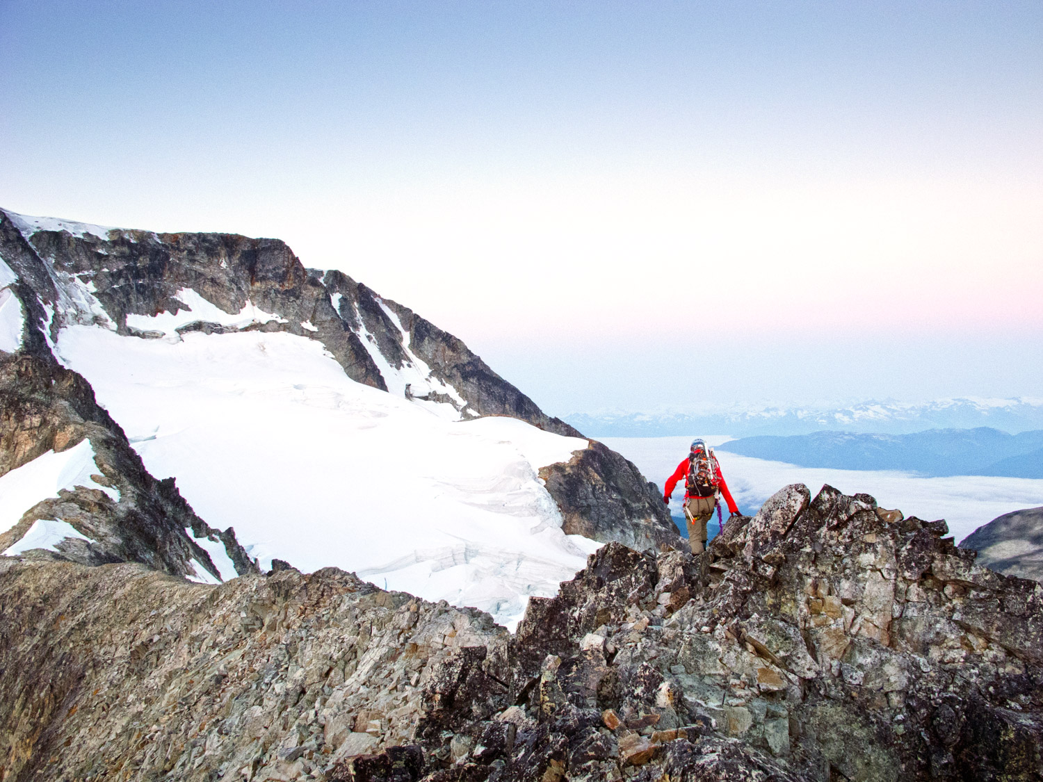  Lone climber on a knife edge ridge. Wedge Mountain, Canada 