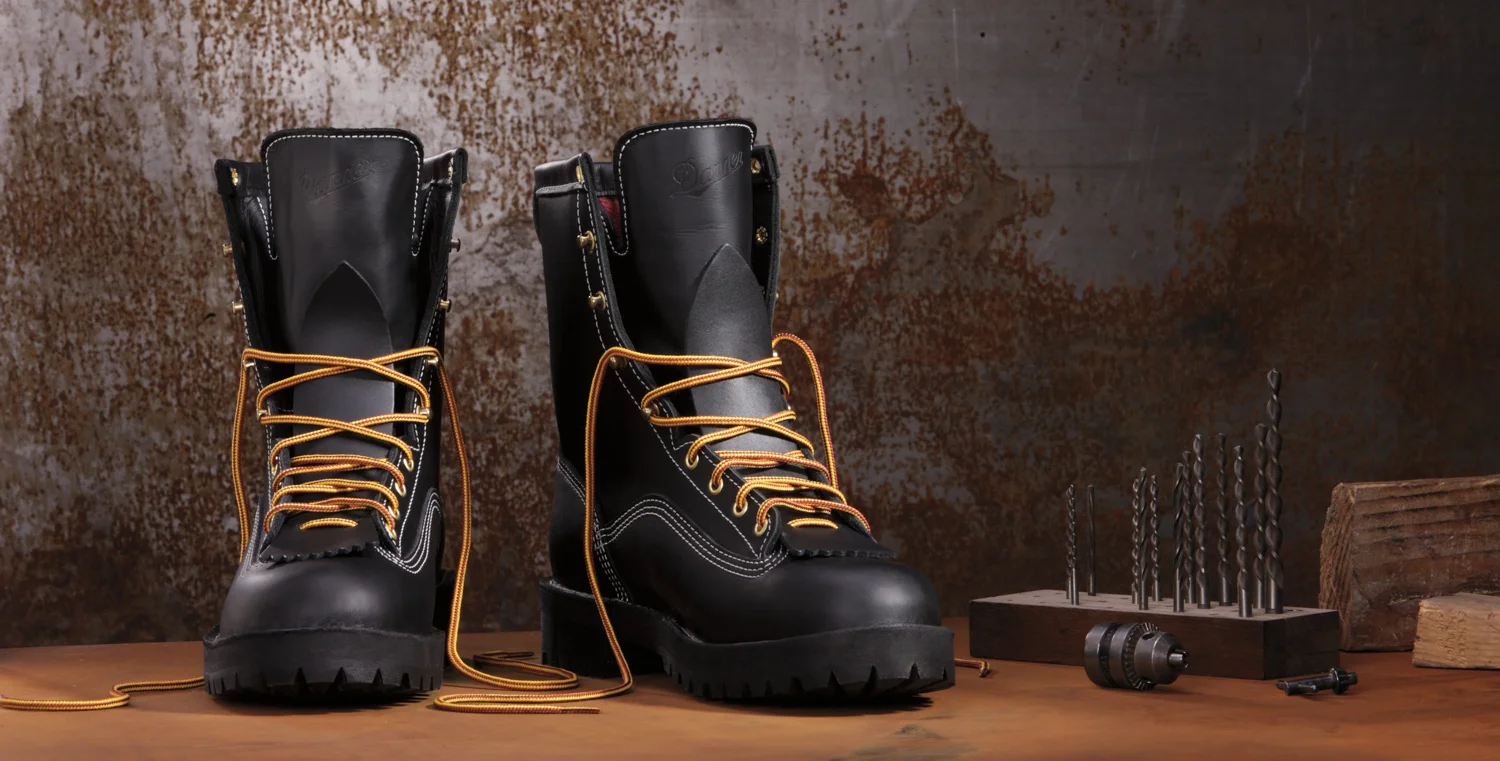 Product photography shot in studio: pair of black Danner boots